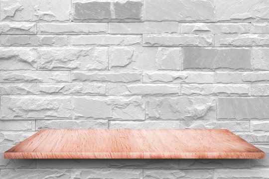 Wood table and white concrete wall background / Vintage wall of gray and desk 