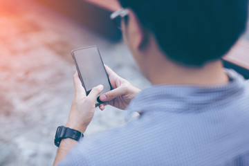 Young asian handsome businessman concentrated while reading his