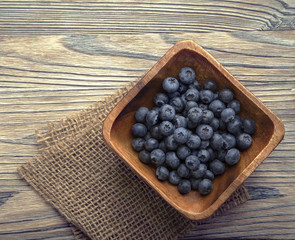 ripe sweet blueberries on wooden table