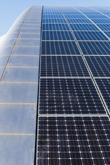 Obraz premium Solar panels on the roof of the building, alternative sources of electricity, advanced technology.