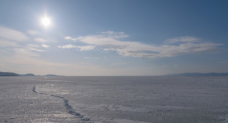Frozen sea view on sunny day.