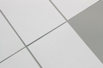 Obraz premium Blank portrait A4. brochure magazine isolated on gray, changeable background / white paper isolated on gray