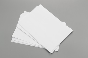 Blank portrait A4. brochure magazine isolated on gray, changeable background / white paper isolated on gray