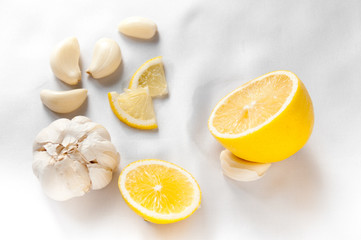Sliced lemon and garlic on the table