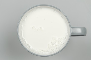 top view of glass milk / Glass of Milk From Above / gray tone - Powered by Adobe