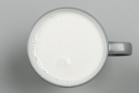 top view of glass milk / Glass of Milk From Above / gray tone