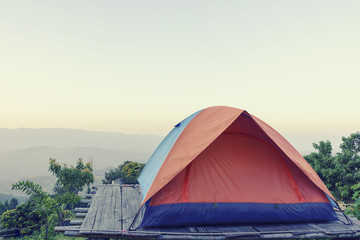 Camping tent on top of mountain field