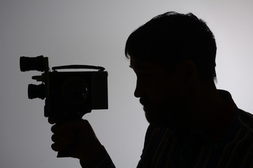 Silhouette bearded Man Movie Camera