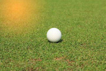 Golf ball on fairway in golf course