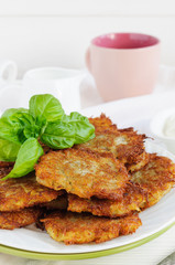 Potato pancakes and cup of milk