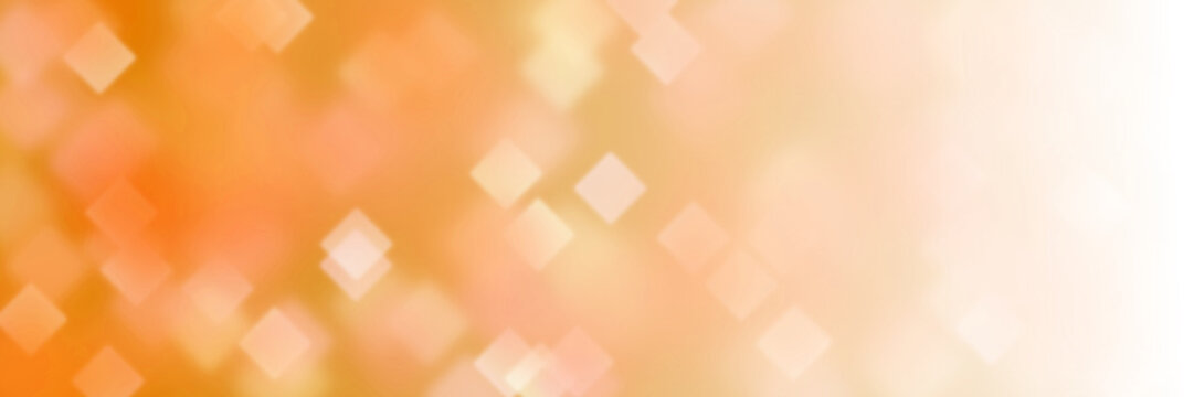 sunlit and intense background banner with diamond bokeh effects in shades of orange and white
