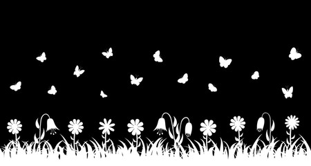 Butterflies over the grass and flowers.