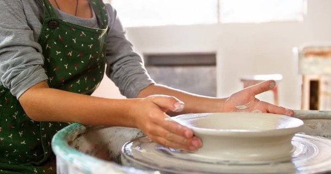 Portrait of girl making pot