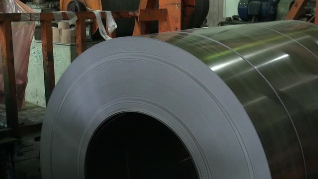 Engine factory. machine moving a big cylinder