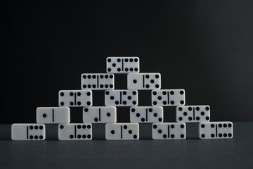 Tower of white domino play pieces