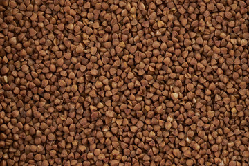 buckwheat grains closeup top view background. Healthy food