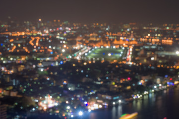 De-focused image Abstract blurred bokeh lights city skyline in Bangkok, The Royal palace and Emerald Buddha temple. Thailand tourist attraction.