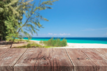 Fototapeta premium Empty wooden table top on the beach.