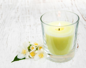Candle and jasmine flowers