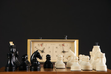 Close up of quick chess with timer on dark background.