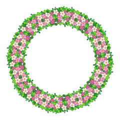 Round colorful frame of flowers. The border of delicate flowers, a wreath with green leaves and pink flowers.