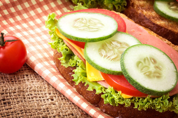Element of  Grilled sandwiches bread with bacon , ham and cheese