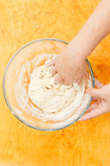 Photography of cook kneads dough