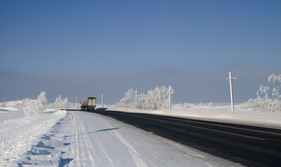 The road in the winter in the background