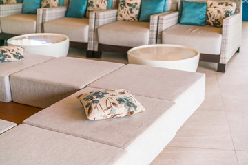 Closeup of modern furniture with pillows .