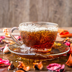 Transparent mug with herbal tea