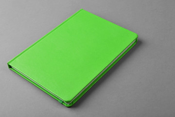 Fototapeta premium Blank green book on grey background
