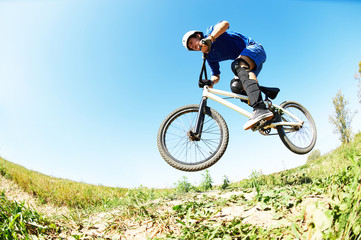 Fototapeta na wymiar cyclist riding jumping with bicycle cross-country