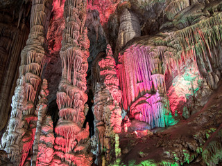 Majestic image of colorful karts caves with stalactites and stalagmites, Shihua cave, China.