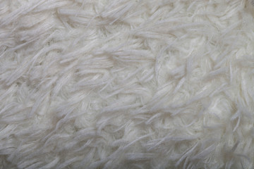 Top view on texture of white artificial fur for background