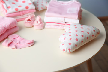 Fototapeta na wymiar Set of baby clothes on light table