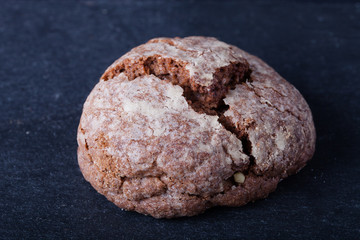 Homemade chocolate cookies, shortbread on a black slate table