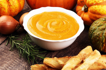 Pumpkin soup on a wooden table