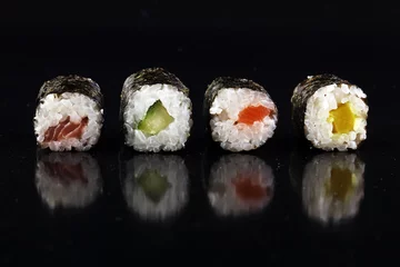 Selbstklebende Fototapeten close up of sashimi sushi set with chopsticks and soy - sushi roll with salmon and sushi roll with smoked eel, selective focus. © beats_