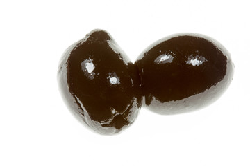 Ripe black olives on a white background