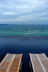 Obraz premium Wooden Sundeck on Swimming pool at Sea view