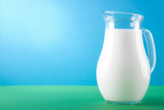 organic milk in carafe on nature