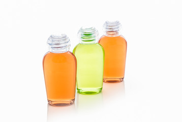 Orange and green bottle of shampoo, gel, soap