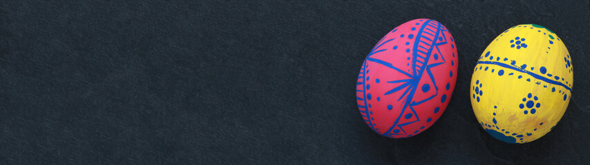 Colorful easter eggs on a blackboard 