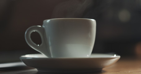 steam rising from espresso cup with fresh hot coffee shallow focus, 4k photo