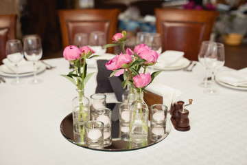 bouquet of flowers in a vase on a wedding table