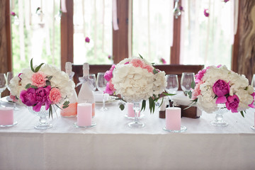 bouquet of flowers in a vase on a wedding table