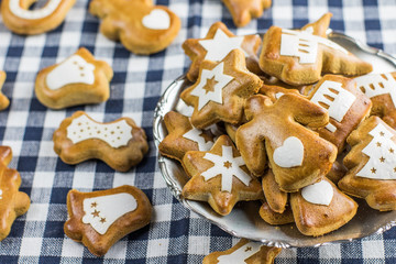 Christmas gingerbread shaped angel with heart with other gingerb