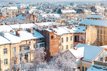 Winter view on the old town with snowbound roofs in Lviv city, Ukraine