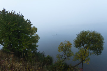 Fog over pond Chizhovsky reservoir, the city of Minsk, Belarus, October, autumn, morning,