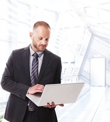 Caucasian businessman using laptop